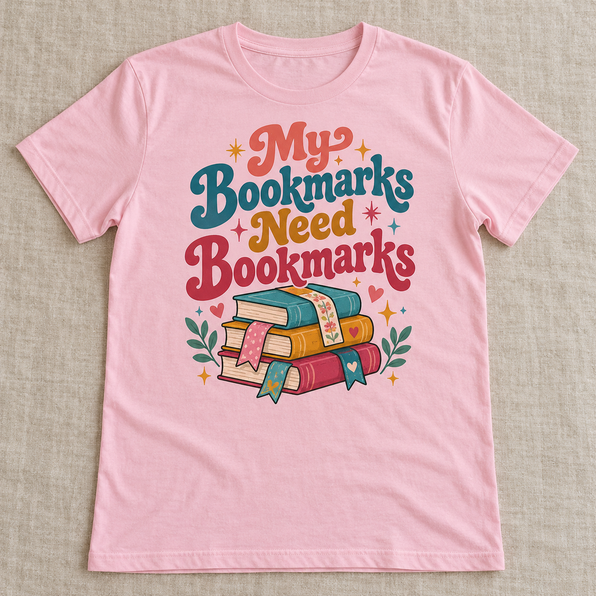 My Bookmarks Need Bookmarks tee shown in Light Pink