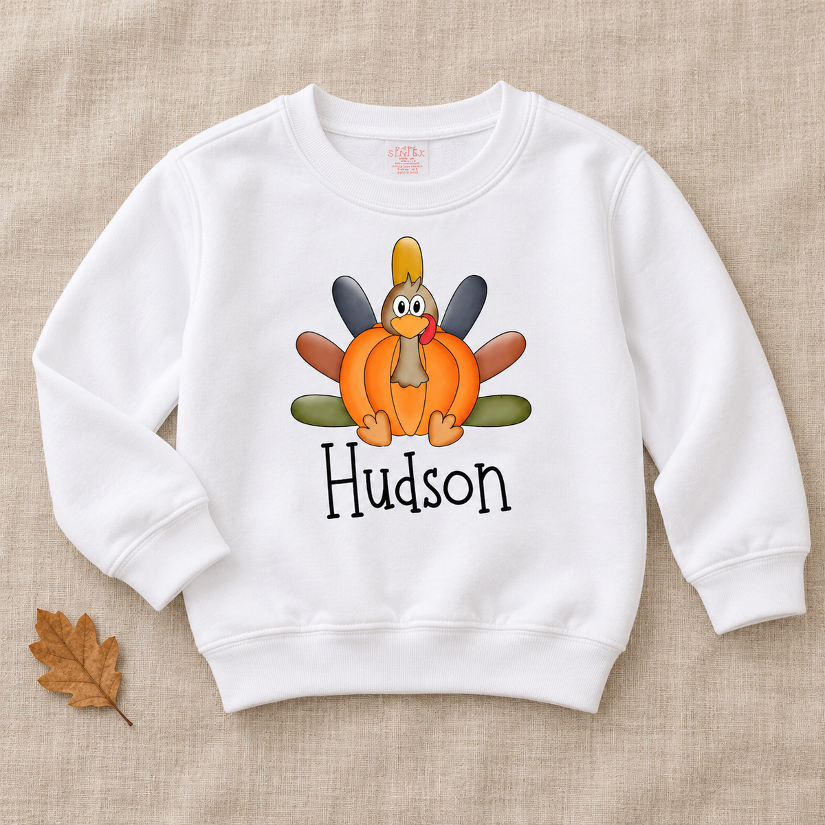 Hudson Personalized Pumpkin Turkey Kids Tee — artwork preview on sweatshirt; product sold as short-sleeve tee